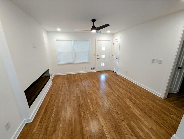 4430 Locksley Rd, Tucker, GA 30084 - unfurnished living room featuring wood finished floors, baseboards, and ceiling fan
