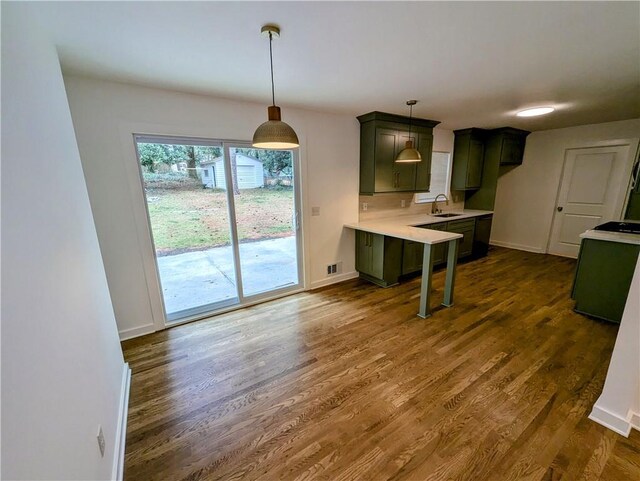 4430 Locksley Rd, Tucker, GA 30084 - kitchen with visible vents, dark wood finished floors, light countertops, stove, and a sink