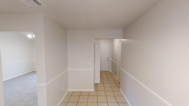 hallway with light tile patterned flooring