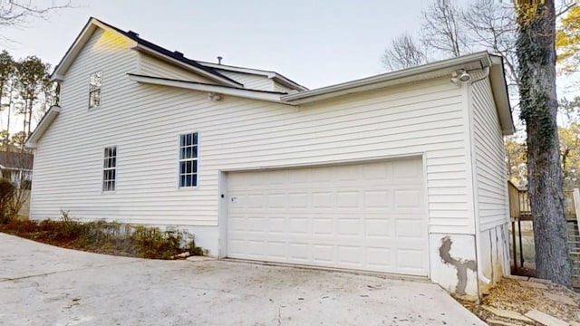 view of side of property featuring a garage