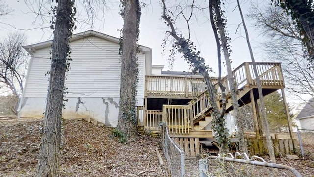 rear view of property with a wooden deck