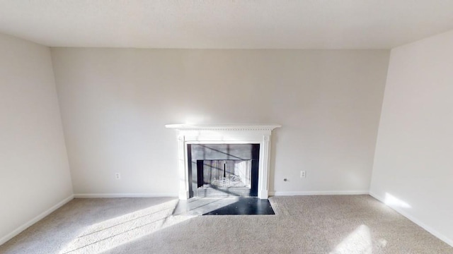 unfurnished living room with carpet floors