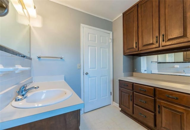 bathroom featuring vanity and decorative backsplash