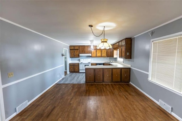 kitchen with white electric range oven, decorative light fixtures, ornamental molding, dark hardwood / wood-style floors, and kitchen peninsula