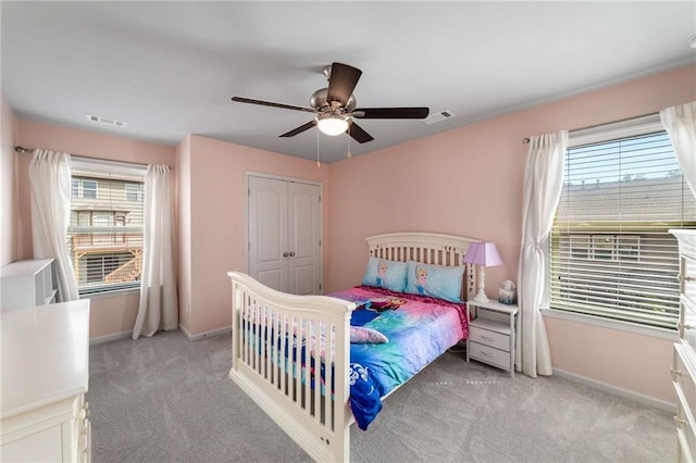 1520 Gallant Fox Ln, Suwanee, GA 30024 - carpeted bedroom with multiple windows, baseboards, and a ceiling fan