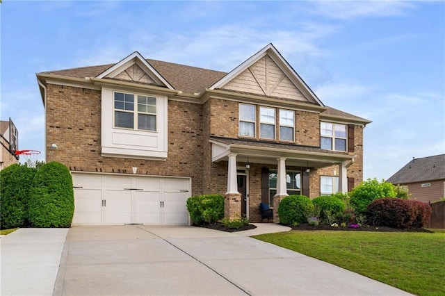 1520 Gallant Fox Ln, Suwanee, GA 30024 - craftsman house featuring concrete driveway, a garage, brick siding, and a front yard