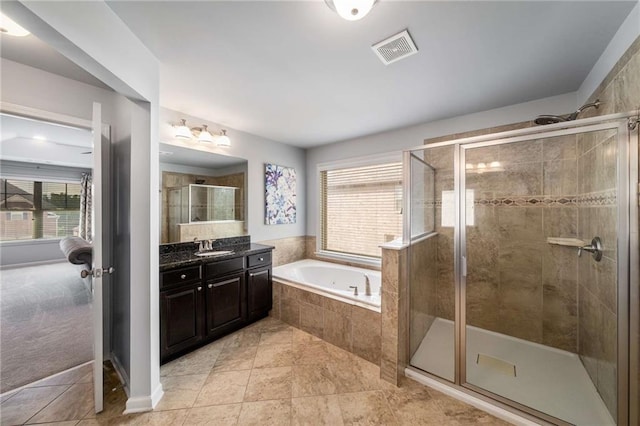 1520 Gallant Fox Ln, Suwanee, GA 30024 - full bath with healthy amount of natural light, a stall shower, a garden tub, and vanity