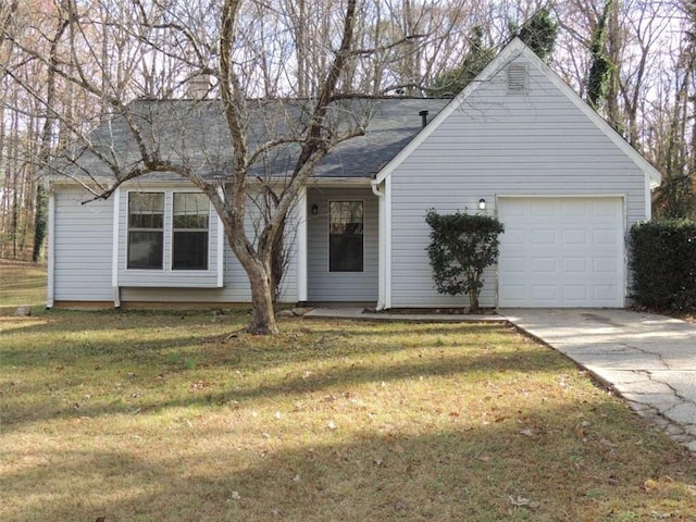 ranch-style home with a front yard and a garage