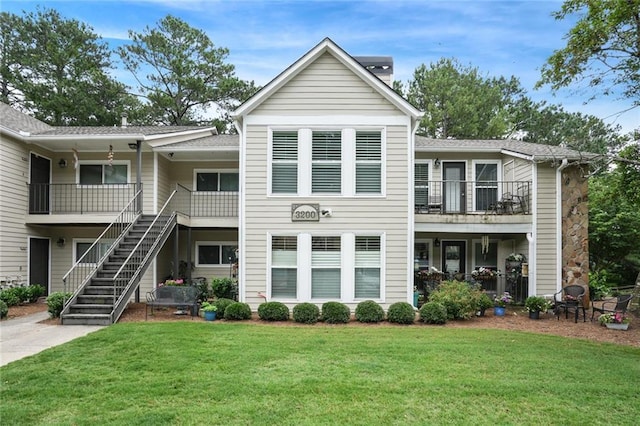 3210 Lake Pointe Cir, Roswell, GA 30075 - view of front of home with a front lawn, stairway, and a balcony