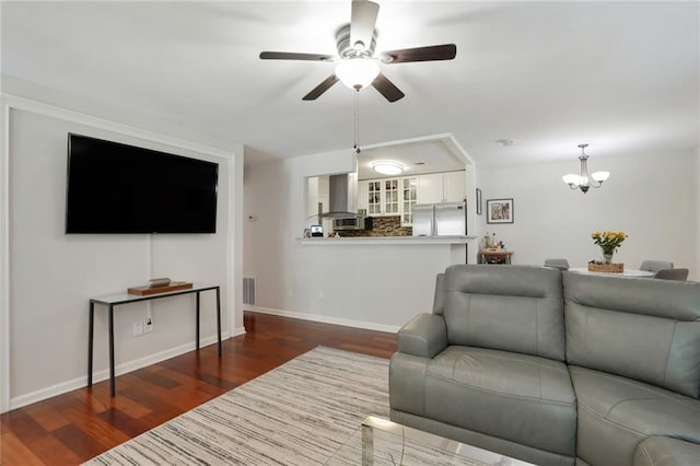 3210 Lake Pointe Cir, Roswell, GA 30075 - living room featuring wood finished floors, a ceiling fan, and a chandelier