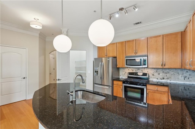 3621 Vinings Slope SE Unit 3510, Atlanta, GA 30339 - kitchen with appliances with stainless steel finishes, a sink, crown molding, hanging light fixtures, and tasteful backsplash