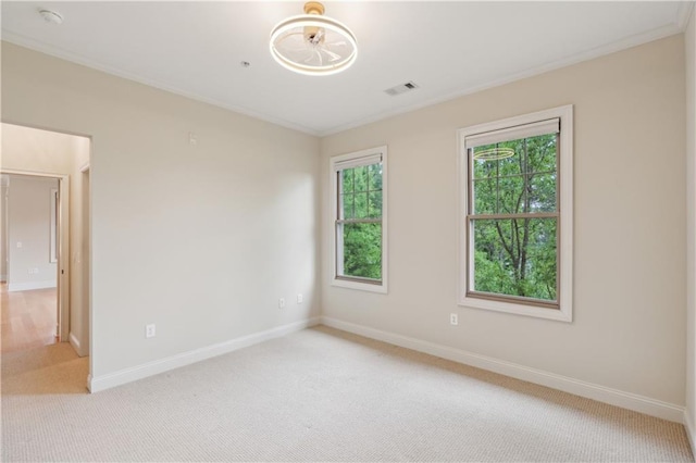 3621 Vinings Slope SE Unit 3510, Atlanta, GA 30339 - spare room featuring crown molding, light carpet, baseboards, and a smoke detector
