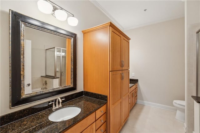3621 Vinings Slope SE Unit 3510, Atlanta, GA 30339 - bathroom with ornamental molding, a shower with door, vanity, baseboards, and toilet