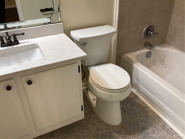 full bathroom featuring vanity, toilet, tile patterned flooring, and tiled shower / bath