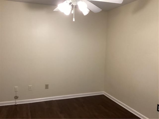 spare room with hardwood / wood-style flooring and ceiling fan