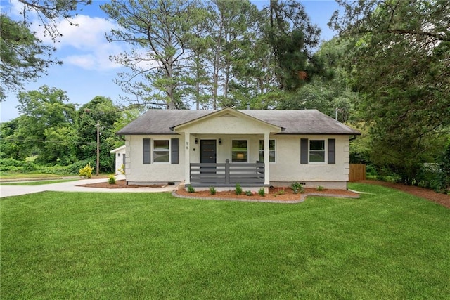96 Senoia Rd, Fairburn, GA 30213 - bungalow-style house with covered porch, a front yard, driveway, and stucco siding