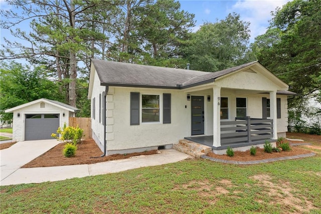 96 Senoia Rd, Fairburn, GA 30213 - view of front of house featuring covered porch, a garage, roof with shingles, an outbuilding, and driveway