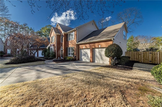 view of front of house with a garage, fence, concrete driveway, and brick siding