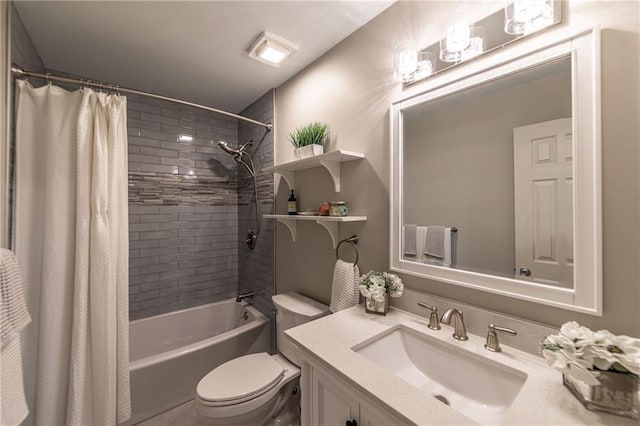 bathroom with toilet, shower / tub combo, and vanity