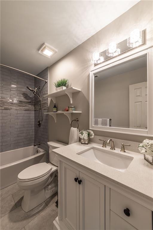 bathroom featuring toilet, shower / washtub combination, and vanity