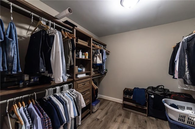 spacious closet with wood finished floors