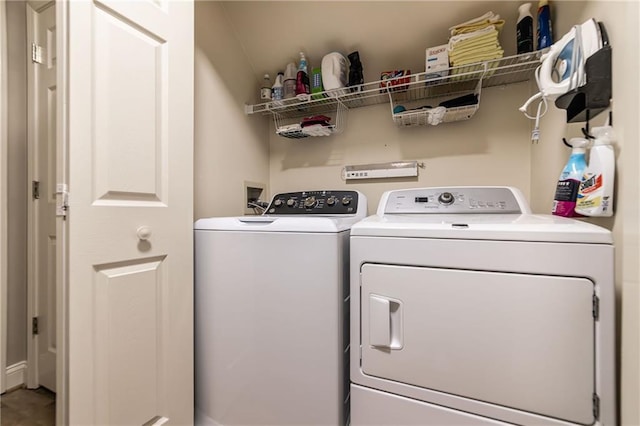 laundry room with laundry area and washing machine and clothes dryer