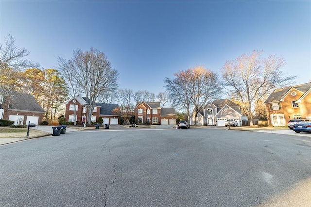 view of road with a residential view, curbs, and sidewalks