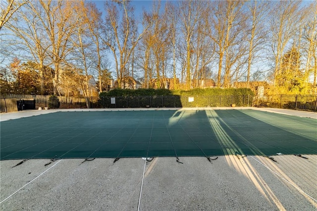 view of pool featuring a patio area, fence, and a fenced in pool