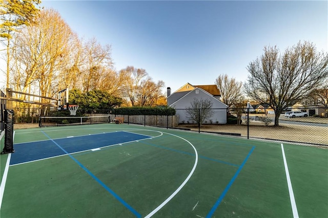 view of sport court featuring community basketball court and fence