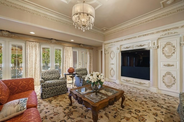 carpeted living room featuring crown molding and a chandelier