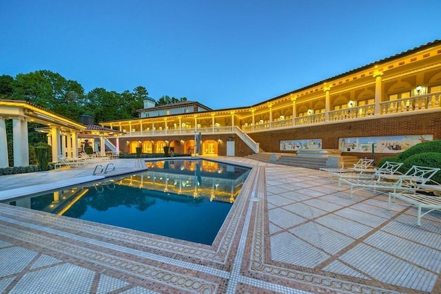 view of swimming pool with a patio