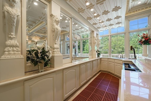 unfurnished sunroom with coffered ceiling