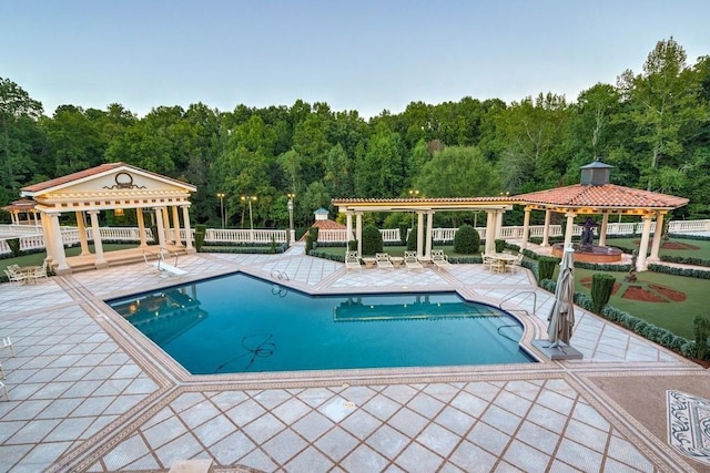 view of swimming pool with a gazebo and a patio