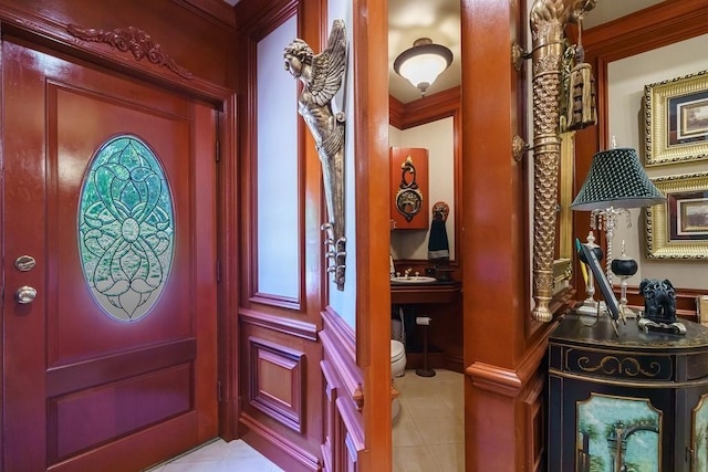 tiled entryway featuring sink