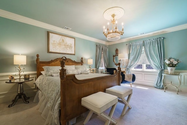 carpeted bedroom featuring a notable chandelier and ornamental molding