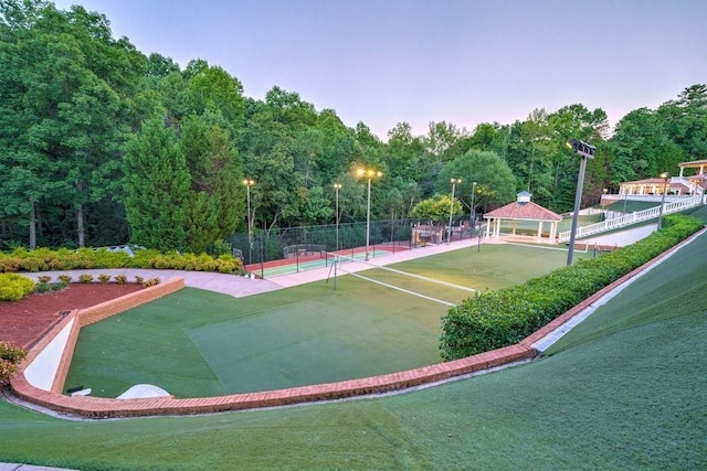 surrounding community with tennis court and a gazebo