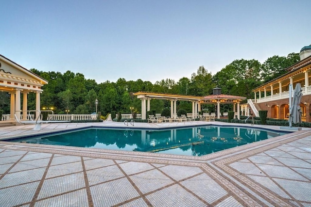 view of pool with a patio and a gazebo