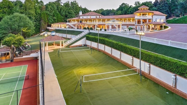 view of property's community featuring a gazebo and tennis court