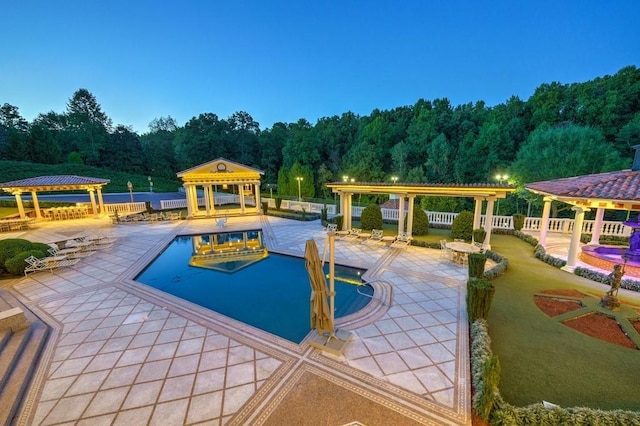 view of swimming pool with a patio area and a gazebo