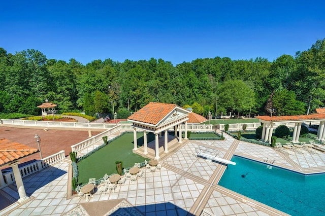 exterior space with a patio and a diving board