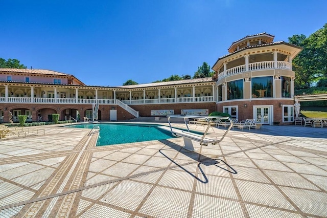 view of pool featuring a patio area