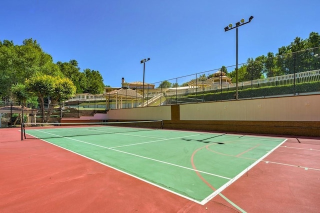 view of tennis court featuring basketball court