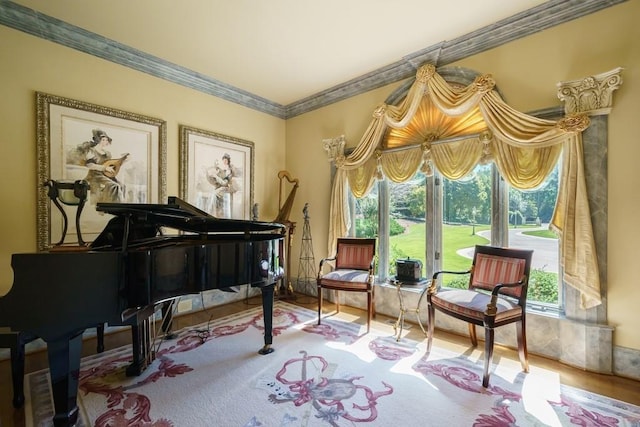 miscellaneous room with crown molding and light hardwood / wood-style floors