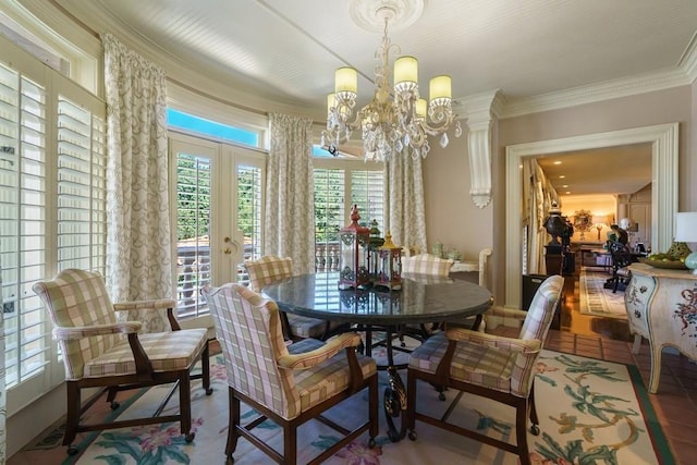 dining space with a notable chandelier, crown molding, french doors, and wood-type flooring