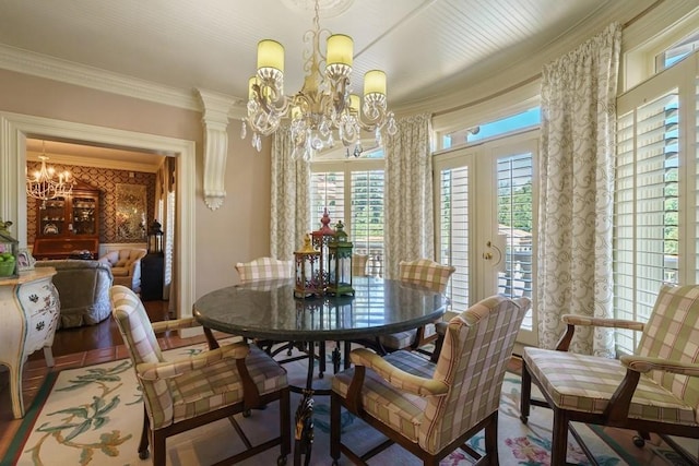 dining area featuring dark hardwood / wood-style flooring, a notable chandelier, and crown molding