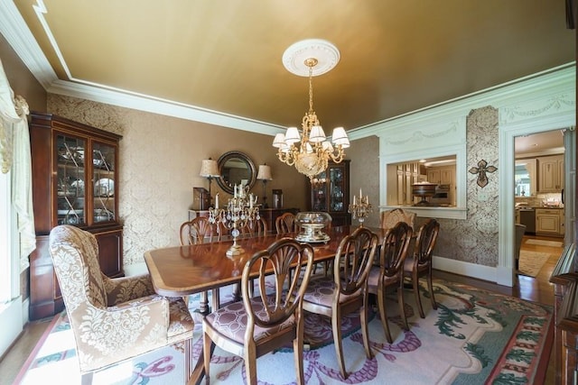 dining space with crown molding, a chandelier, and wood-type flooring