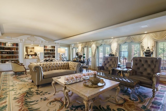 living room with built in features and vaulted ceiling