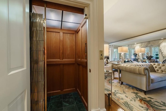 interior space featuring dark tile floors