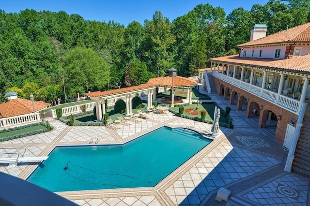 view of swimming pool featuring a gazebo and a patio