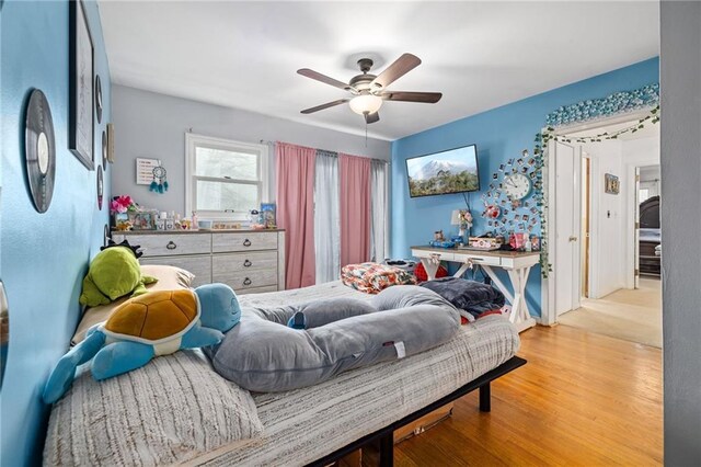 bedroom with ceiling fan and wood finished floors